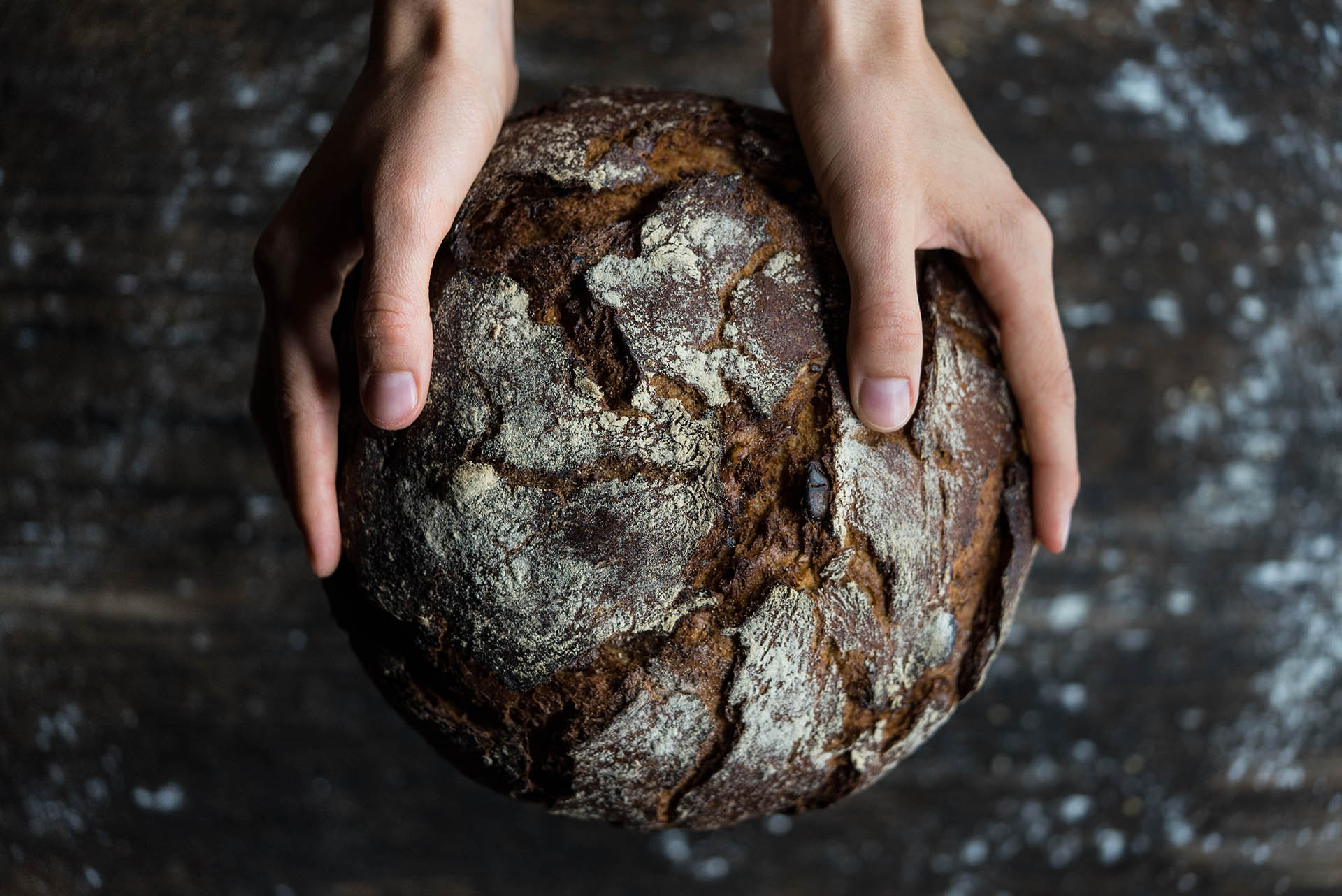 human-holding-a-bread-745988-1
